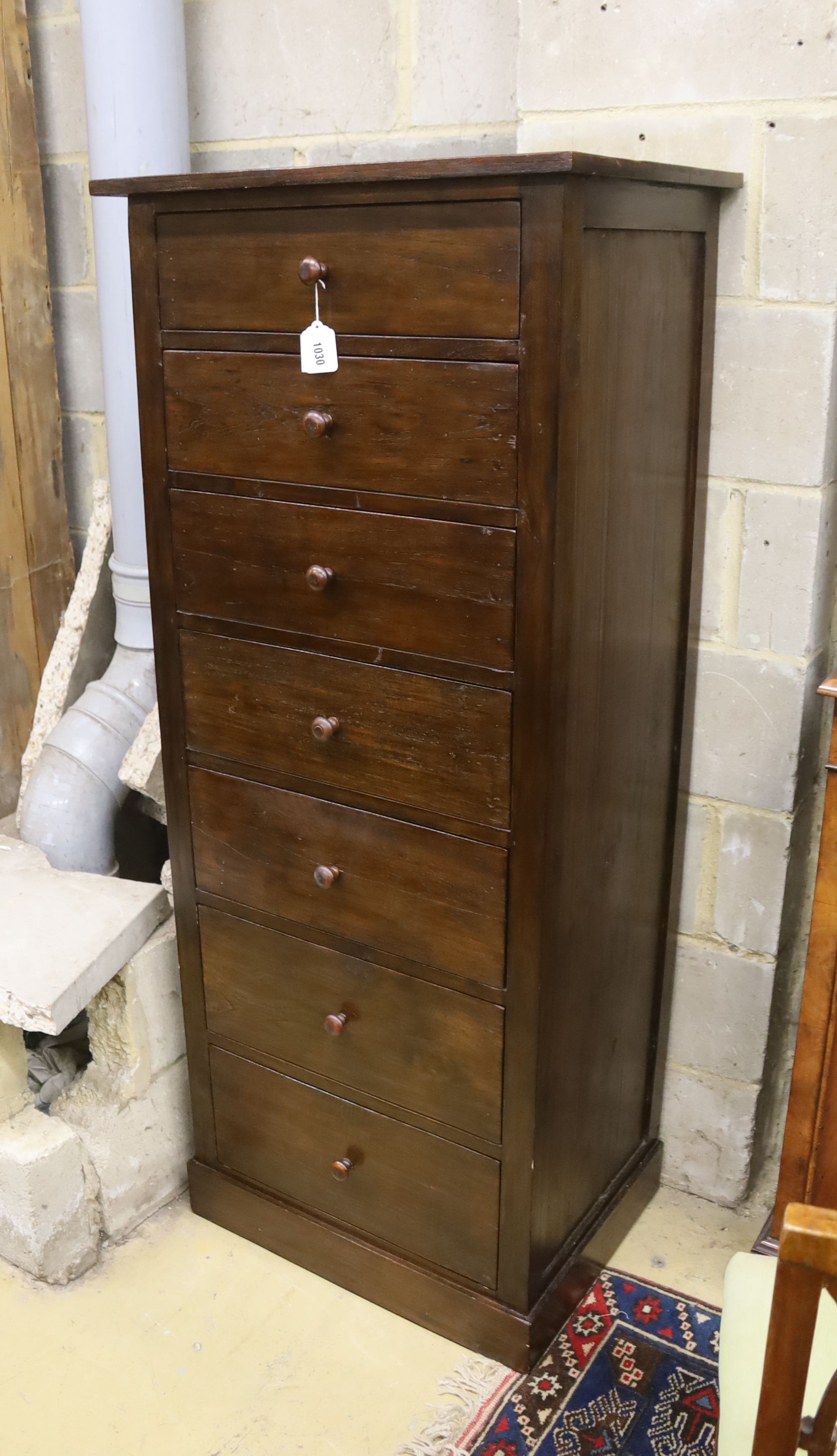 A modern hardwood seven drawer tall chest, width 63cm, depth 48cm, height 152cm